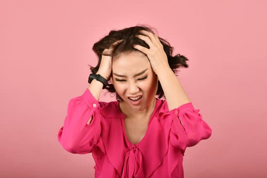 Angry asian woman, Screaming girl with furious aggressive hand gesture on pink background, Face expression and human emotion.